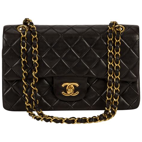 black and gold chanel purse|black chanel bag gold chain.